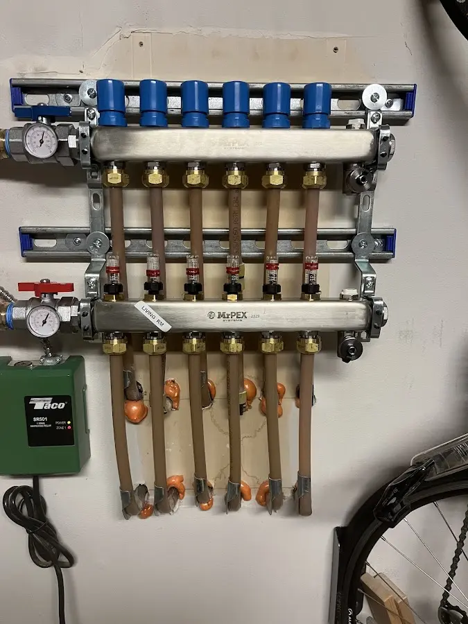 Plumber performing Leak Detection at a residential property in Lenox